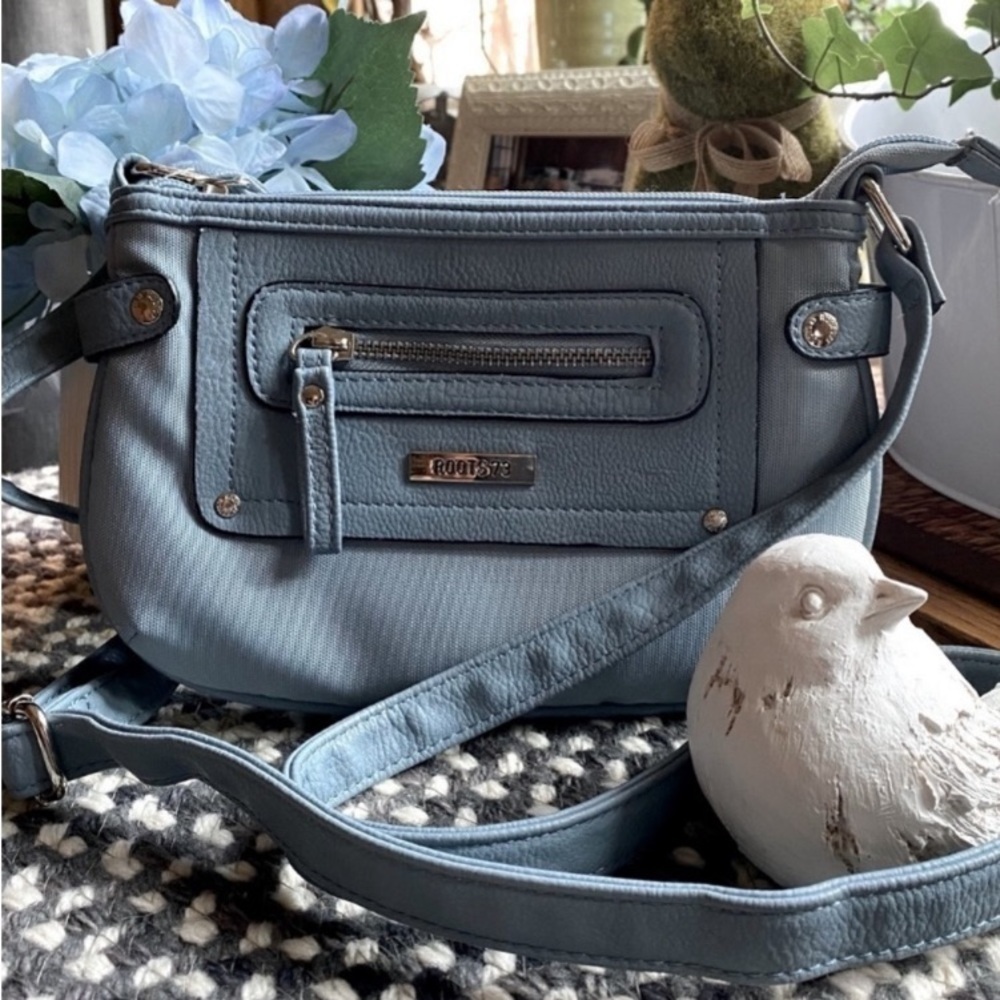 Roots 73 small shoulder bag in light blue grey colour​​​​​​